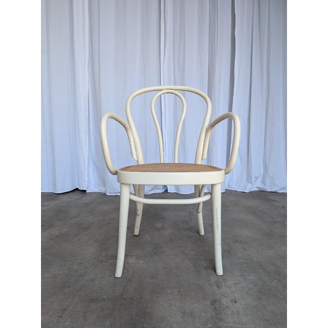 Vintage Thonet style bentwood dining armchair manufactured by STOL Kamnik in former Yugoslavia during the 1970s. The chair...