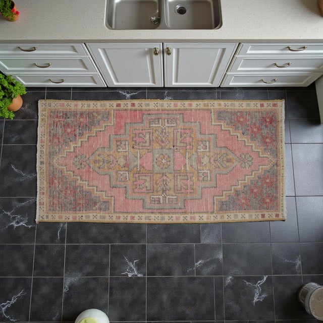 Vintage Turkish Hand-Knotted Small Rug from Oushak, 1970, featuring warm dusty rose tones and authentic village...