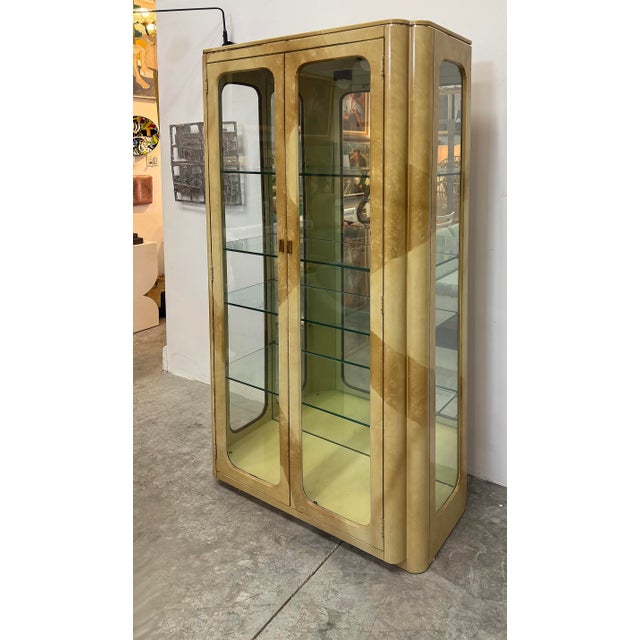 Vintage Laquered Faux Goatskin Vitrines, Pair Offered for sale is an elegant pair of vintage "faux" goatskin vitrine...