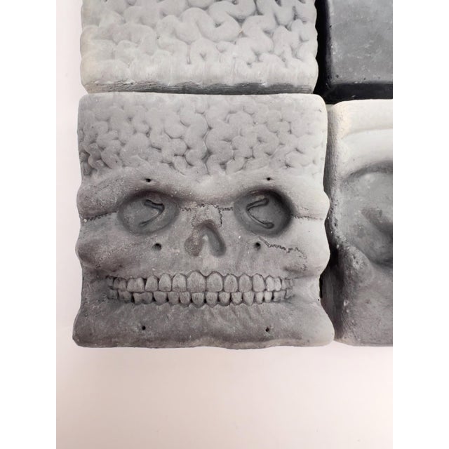 Here is a rare opportunity to own a collection of four artworks by American sculptor Richard Notkin: Cube Skull with...