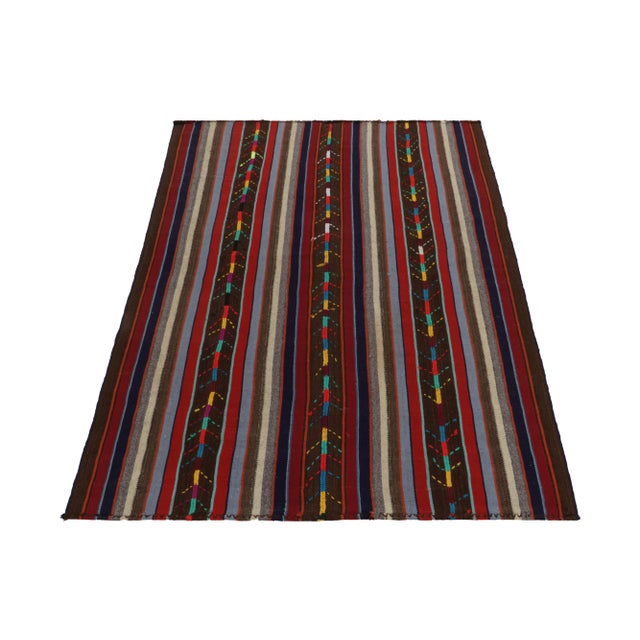 Handwoven in Turkey circa 1950-1960, this 6x8 vintage Chaput style Kilim rug enjoys a one of a kind approach in weaving....