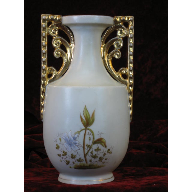 The bottom logo, which has some wear to it, is blue and reads "Victoria Carlsbad" with a Bird or an Angle, one of their...