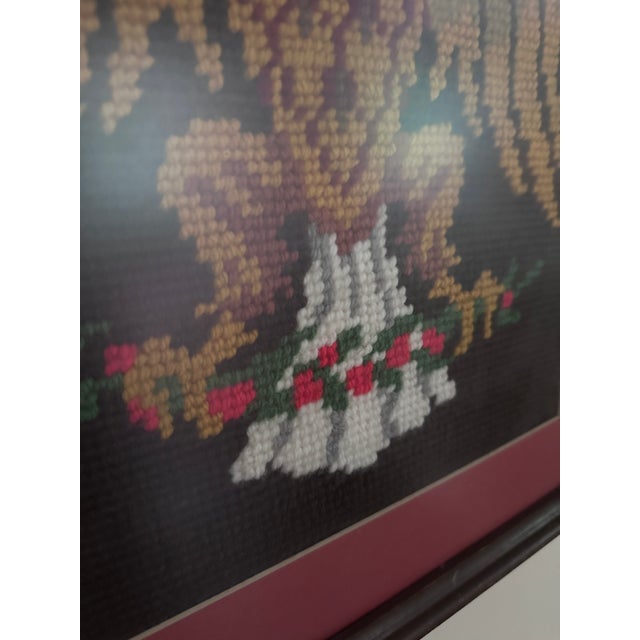 A striking vintage needlepoint featuring a classic American bald eagle, beautifully worked in rich shades of burgundy,...