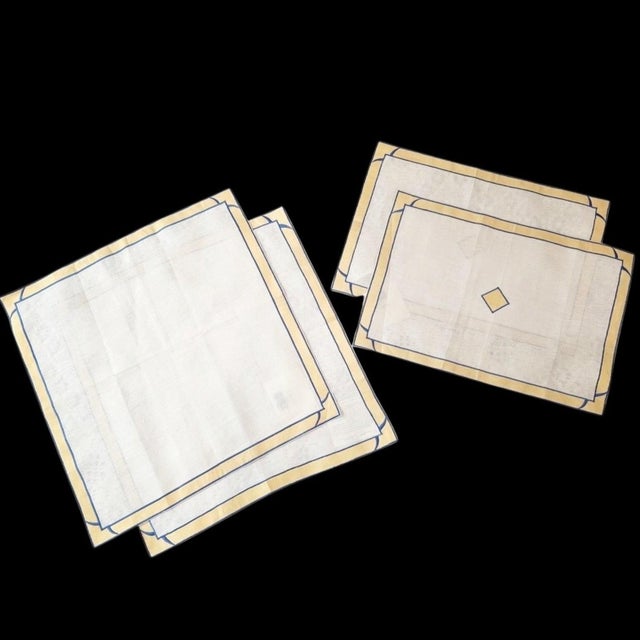 An elegant four-piece set of vintage Lynn Chase table linens featuring a refined geometric design in soft buttery yellow...