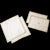 An elegant four-piece set of vintage Lynn Chase table linens featuring a refined geometric design in soft buttery yellow...