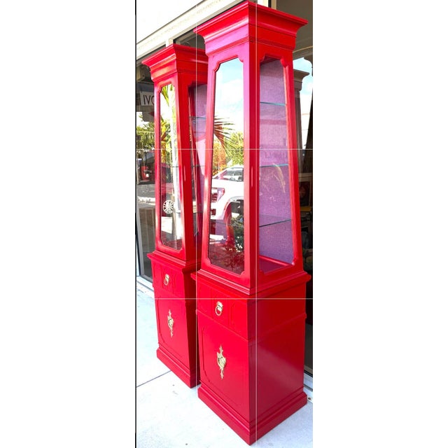 Pair of Vintage Spanish Revival style obelisk cabinets newly refinished in a vibrant red lacquer with solid brass hardware...