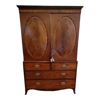 English 19th Century George III Style Linen Press Armoire With Flame Mahogany Oval Paneled Doors For Sale