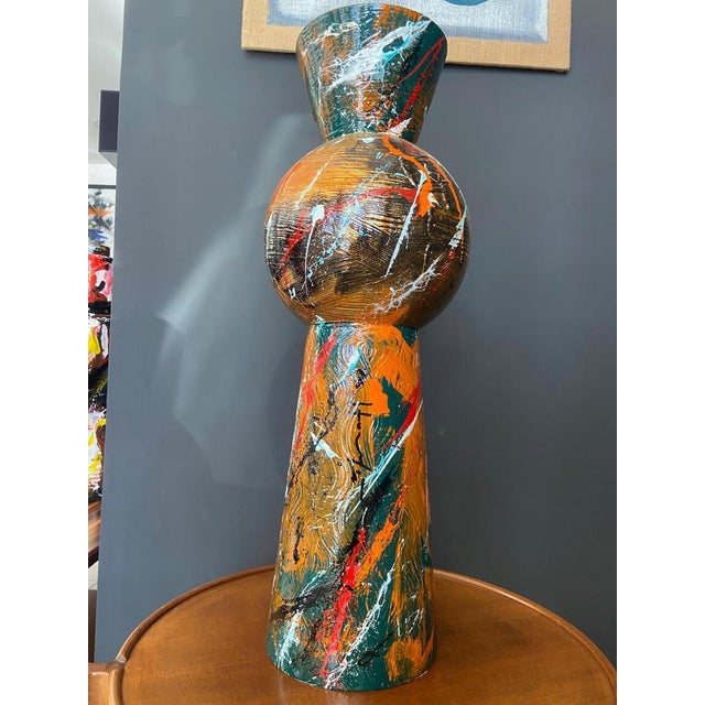 Metal vase in copper, orange, white and red created by artist Silvio Formichetti This piece has an attribution mark, I am...