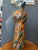 Metal vase in copper, orange, white and red created by artist Silvio Formichetti This piece has an attribution mark, I am...