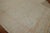 An early 20th century antique Turkish Oushak rug consisting of an ivory ground, predominant accents goldenrod, pink,...