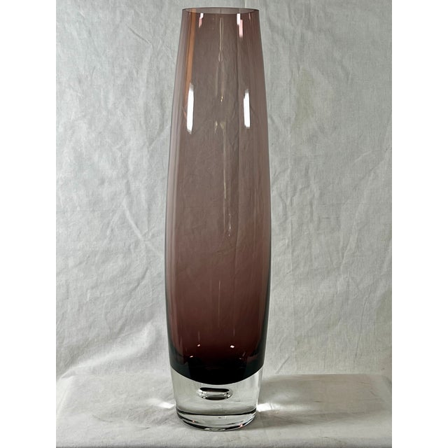 Large Swedish-style vase in amethyst colored glass Air bubble in the base No damage and no chips. 15.75"H x 3-75"W 2.75"...