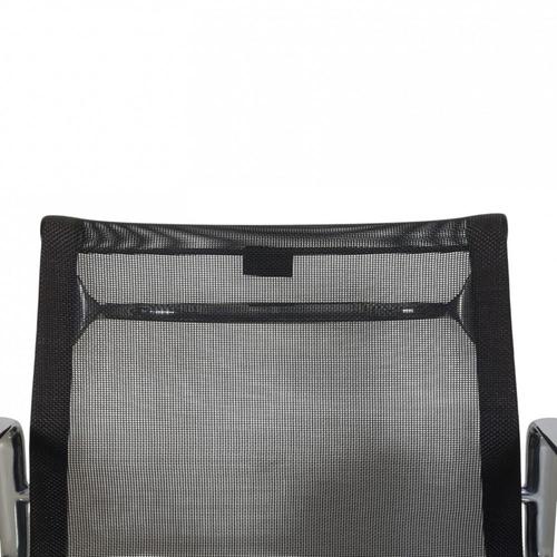 Charles Eames EA-117 office chair upholstered in black mesh, with chrome armrests and frame. The chair is from 2002 and...