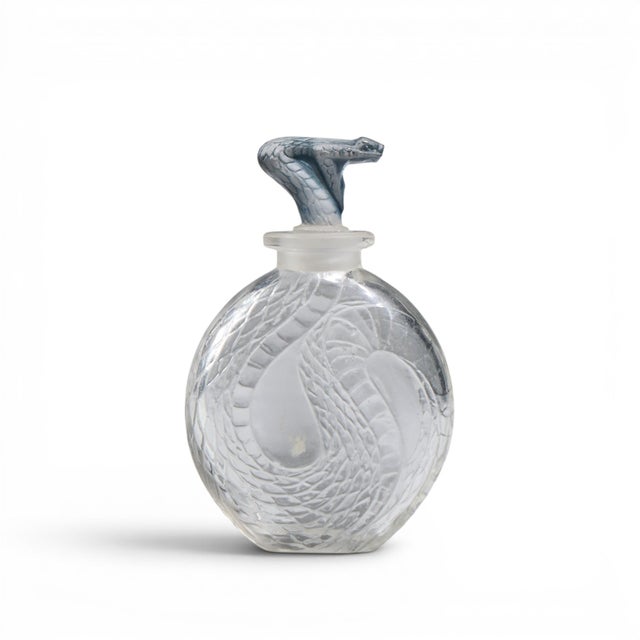 René Lalique Serpent Blue Glass Perfume Bottle This perfume bottle measures: 2.25 wide x 1 deep x 3.5 inches high...
