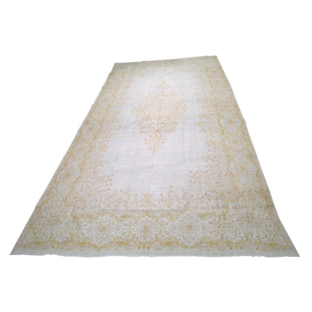 Hand-knotted with care using traditional rug-making techniques, this wool rug blends timeless craftsmanship with a modern...