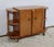Bar cabinet on casters, made of walnut veneer with sycamore interior. This brightly colored piece has two doors featuring...