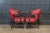 Vintage circa 1920's. Pair 1920's English red studded club chairs. Original Rexine leather buttoned and studded with...