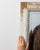 This mirror carries genuine presence, its distressed cream/white carved wood immediately setting the tone for the piece....