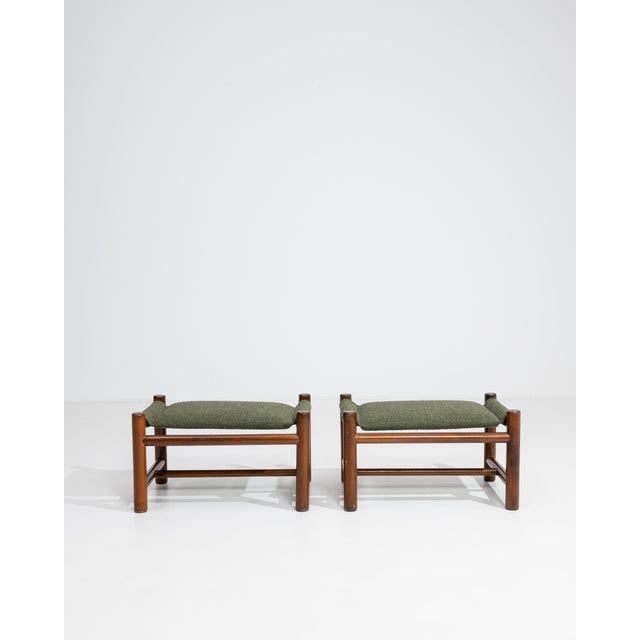 Rendered in the refined spirit of French mid-century modernism, this distinguished pair of upholstered stools embodies the...