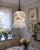 Beautiful vintage frosted glass lamp shade featuring a soft powder-blue exterior decorated with an elegant monochromatic...