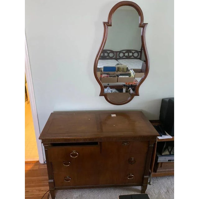 I have a Stunning Baker Furniture Four Drawer Dresser With Detached Mirror. This dresser set is in very good vintage...