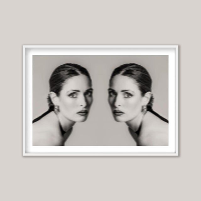 The Double – Like identical twins, yet with subtle distinctions, this sepia-toned black-and-white image invites a closer...