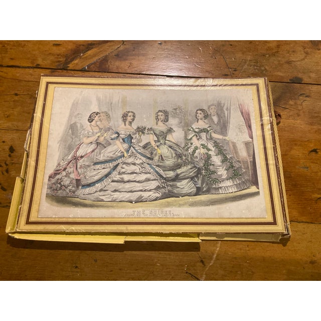 1860s titled "The Soiree," likely featured in Godey's Lady's Book.Engravers: The print was engraved by the New York-based...