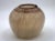 A contemporary earth toned glass vessel with a brown swirl design on the lid by Willem Hessen. Signed on bottom. From a...