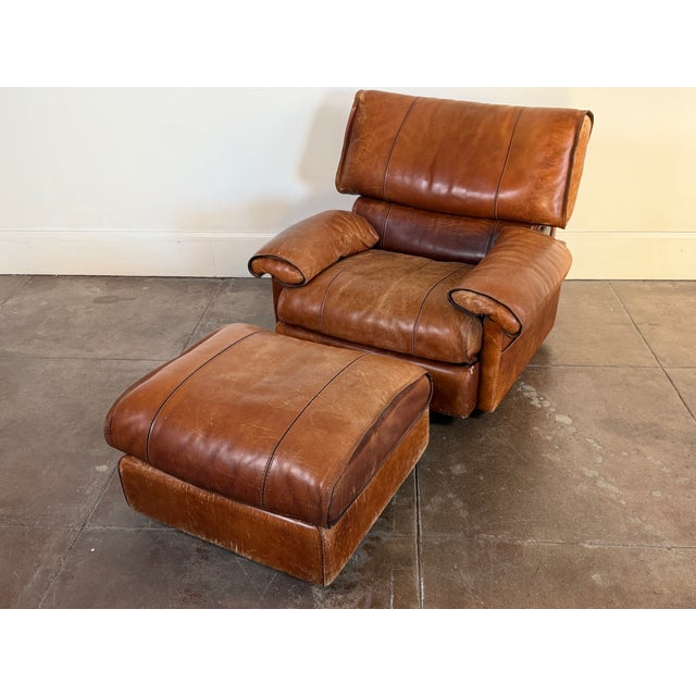 1970's brown leather lounge chair by Roche Bobois in good vintage condition. Patinated leather all around. Unsigned....