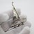 Vintage miniature depicting a sailing boat, handcrafted in Italy in genuine 800 silver. An elegant and refined nautical...