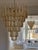 Pair of Large Elegant Eclectic Murano Chandeliers with Drop Formed Glass Prisms in a honey / amber toned color....