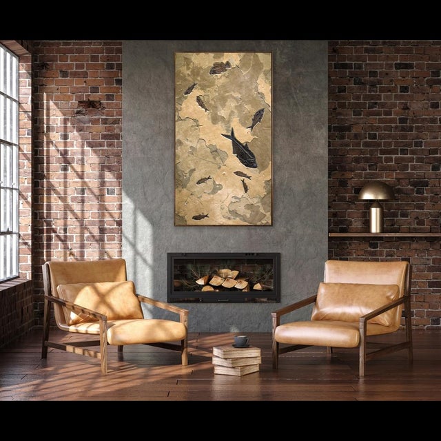 A dynamic tableau of prehistoric life, this fossil mural features two Diplomystus dentatus, a Priscacara serrata, and six...