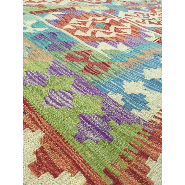 A beautiful traditional Uzbek kilim. This kilim is made of 100% wool, dyed with all natural dyes made from vegetable...