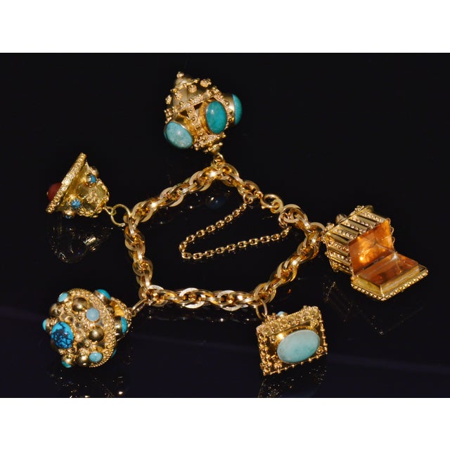 Vintage Italian Etruscan Revival UNOAERRE 18K solid gold turquoise gemstone charm fob bracelet. This bracelet already has...