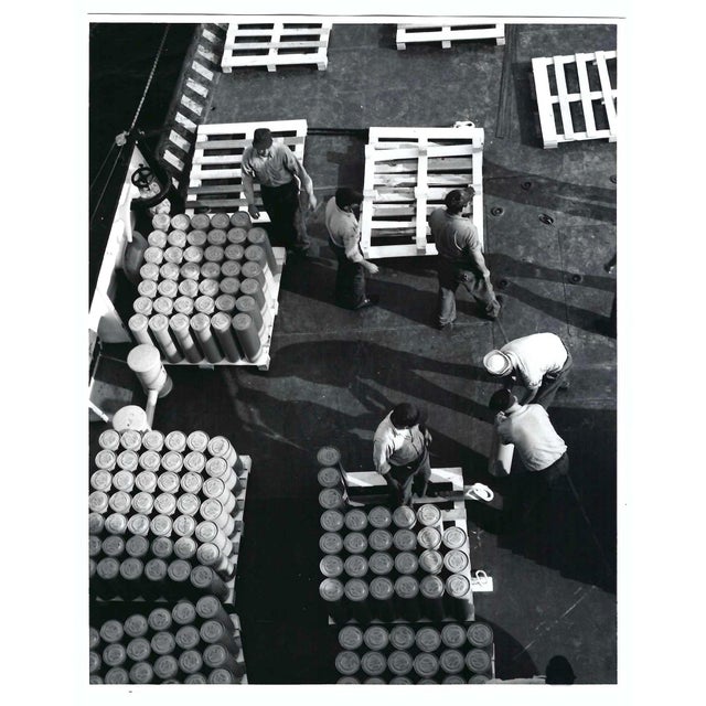 1970s black and white photo of US Coast Guardsmen unloading on dock. Inscribed "US Cast Guard" on the back. Combined...