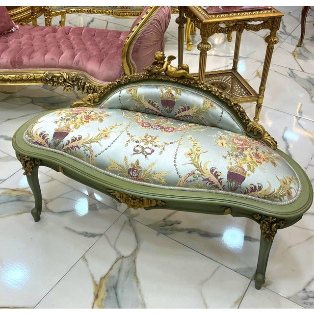 This exquisite antique French-style settee is a timeless statement piece, perfect for elegant interiors. Upholstered in...