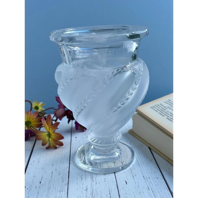 Iconic French crystal by Lalique, the Ermenonville vase features a frosted, bulbous body wrapped with spiraling leafy-vine...