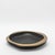 The Lily Bowl in black oak with bronze patina brass details by R&Y Augousti is a stunning embodiment of organic elegance...