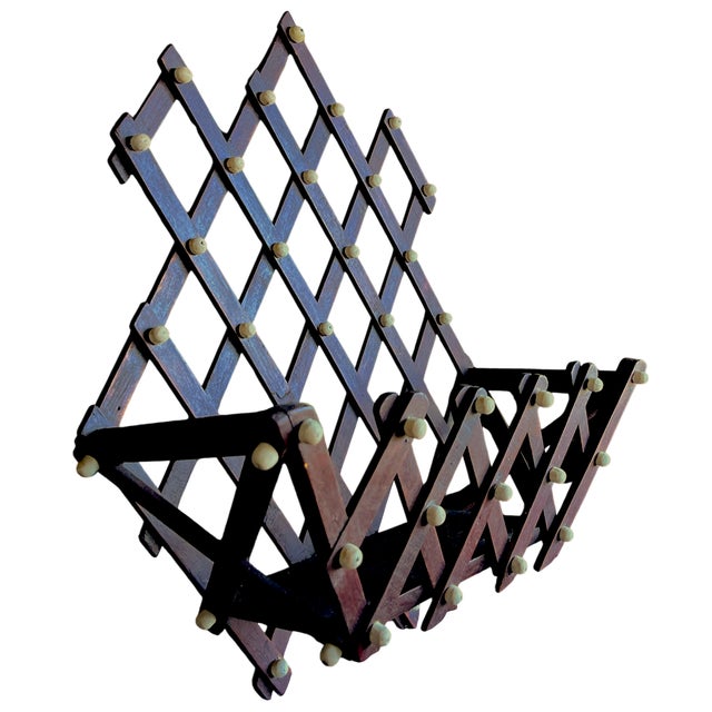 A compelling antique wooden lattice wall pocket shelf. Handmade in the 19th century, this piece reflects practical...