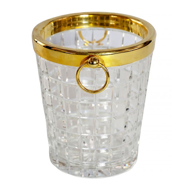 Vintage French cut crystal champagne bucket decorated with gilt metal and handles. Very heavy and solid.