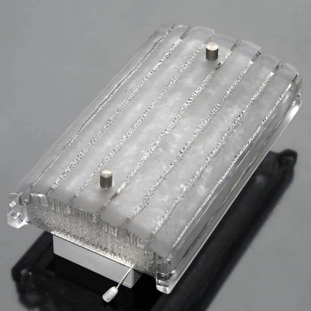 Rare wall light for the bathroom or hallway made of thick structured glass on an aluminum base. Vertical operation....