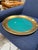 A refined Italian decorative catchall tray from the 1970s, featuring a wide satin brass rim surrounding a rich green glass...