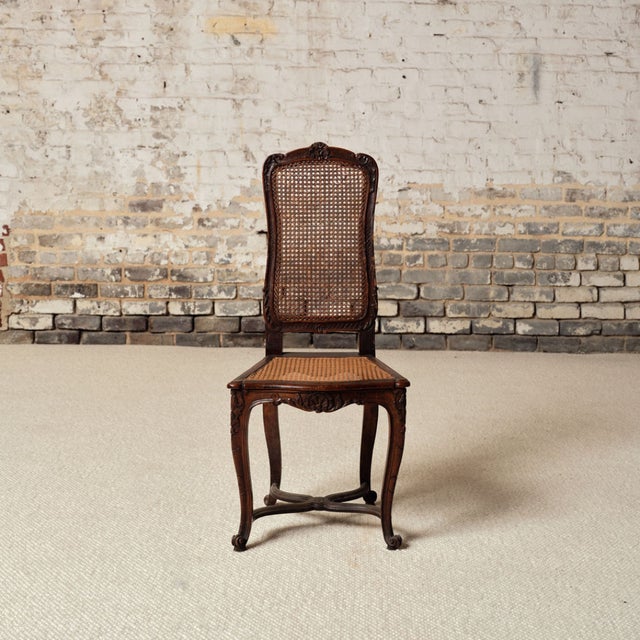 Add timeless French charm to your space with this 19th century French wooden chair, a beautifully crafted piece that...