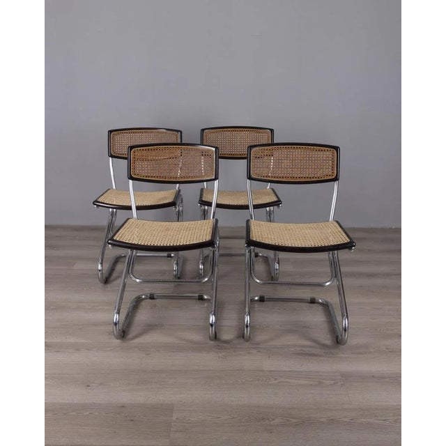 Set of four chairs with chromed metal tubular frame, wooden and Vienna straw seat, Italian design, 1960s.