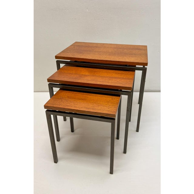 A Mid Century set of slender nesting tables attributed to Cees Braakman for Pastoe. The “floating” teak tops and sleek...