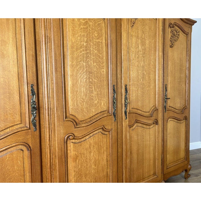 Wood Vintage Louis XVI French Oak Four Door Carved Armoire For Sale - Image 7 of 11