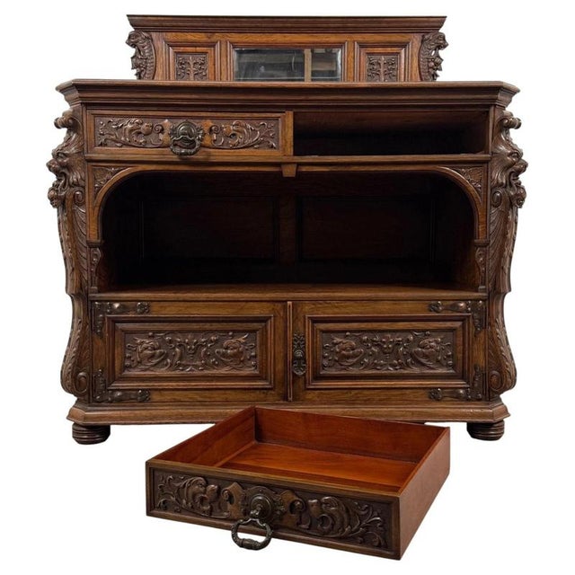 An exceptional 19th-century English sideboard of substantial proportions, finely crafted in highly figured pollard oak and...