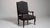 A black wood, Louis XV-style armchair, dating to the 19th century and made in France. The wood frame is finished in...