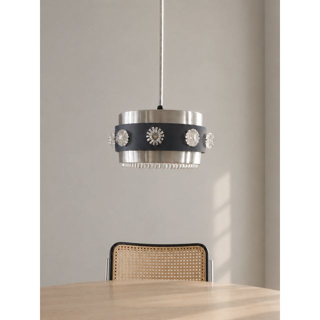 Jeweled glass detailing set into a metal drum shade was a distinctive move in mid-century lighting — turning a simple...