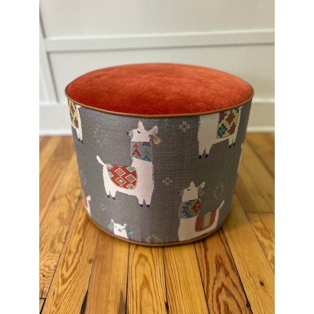 Custom Upholstered Ottoman in Kravet Chenille combined with a Billy goat motif & tan leather welting create a quirky &...
