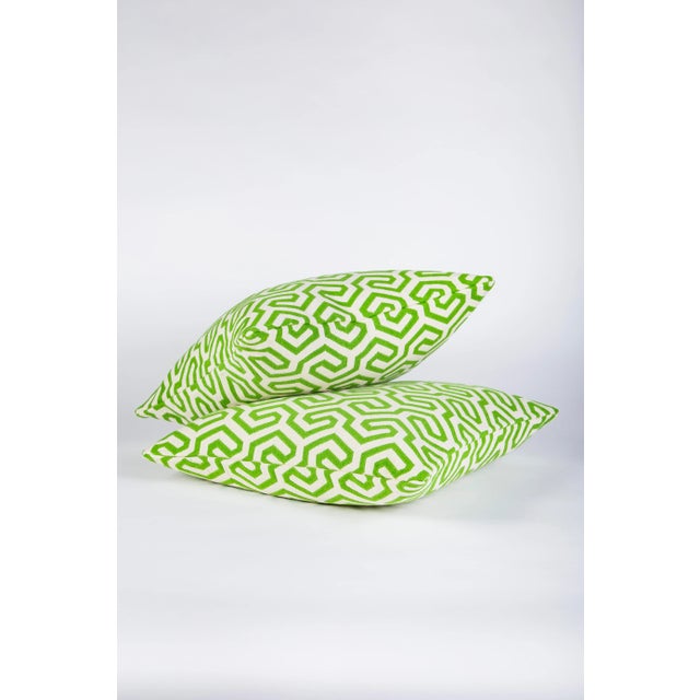 Custom 22" x 22" down filled pillows in striking Schumacher Ming Fret textile. In colorway grass this to the trade textile...